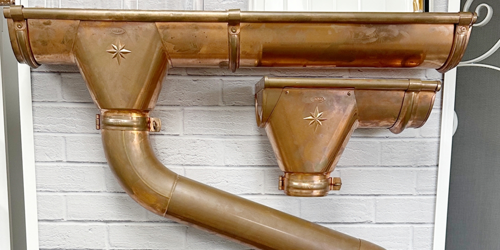 Copper gutter system with downspouts installed in South Florida